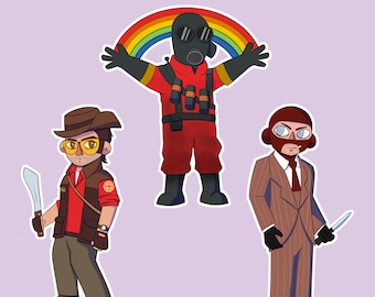 May include: Three cartoon character keychains from the video game Team Fortress 2. The characters are the Scout, the Demoman, and the Heavy. The Scout is holding a knife, the Demoman is holding a bottle of alcohol, and the Heavy is holding a minigun. The keychains are made of acrylic and are approximately 5 cm tall.