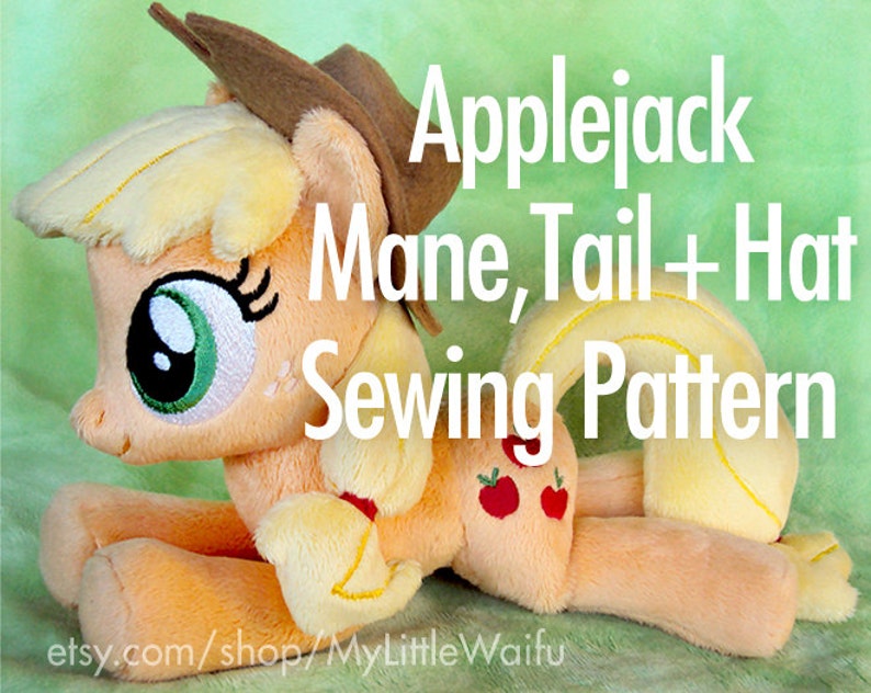 May include: A plush toy of Applejack from My Little Pony, wearing a brown cowboy hat. The toy is lying on its side with its head turned to the left. The toy has a yellow mane and tail, and a light orange body. The toy has green eyes and a pink nose. The toy has a red apple on its flank. The text "Applejack Mane, Tail + Hat Sewing Pattern" is written in white letters on a green background. The text "etsy.com/shop/MyLittleWaifu" is written in white letters on a black background.