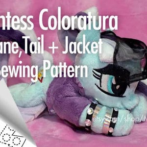 May include: A sewing pattern for a plush toy, featuring a purple and blue pony with a black jacket and sunglasses. The pattern includes instructions for making the mane, tail, and jacket. The text on the pattern reads "Countess Coloratura Mane, Tail + Jacket Sewing Pattern" and "JACKET 2x (1 Mirror) Dark Fuchsia".