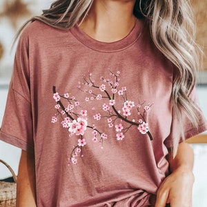 桜のシャツ 花柄グラフィックTシャツ 美しい日本の桜プリント 柔らかいコットン 春 かわいい 自然からインスピレーションを受けた衣装 桜のTシャツ