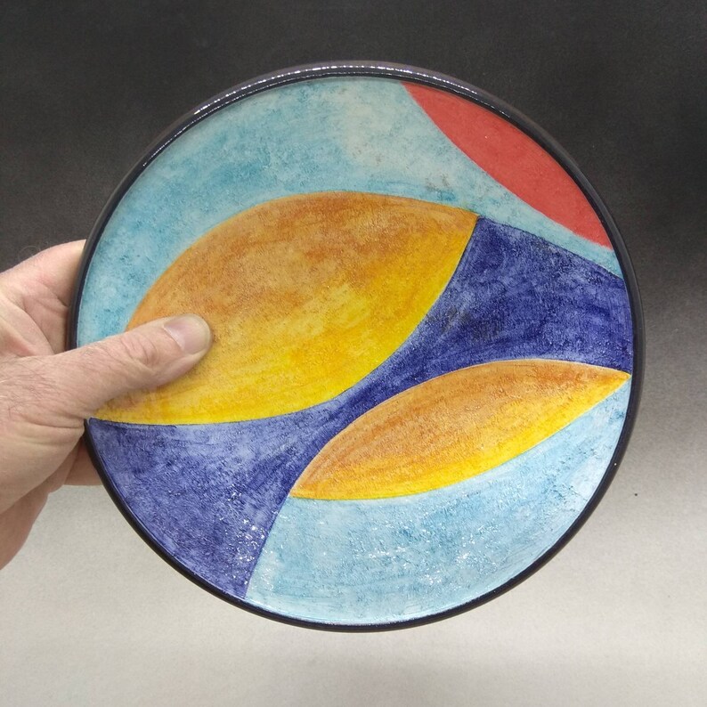 Artistic ceramic bowl shaped on the lathe and decorated by hand. image 1