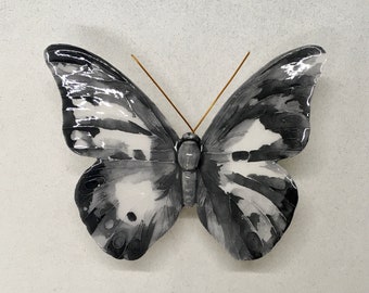 Ceramic butterfly made and decorated by hand. The colors are imaginary but the shape is of a real butterfly.