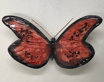 Handmade and hand-decorated ceramic butterfly. The colors are fictional but the shape is of a truly existing butterfly.