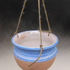 It is a small vase to hang 7.5 Diam Tall cm To be used as aflower holder or as a bird feeder. 10 made at the lathe It is a small vase to hang 7.5 Diam Tall cm To be used as aflower holder or as a bird feeder. 10 made at the lathe
