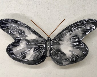 Handmade and hand-decorated ceramic butterfly. The colors are fictional but the shape is of a truly existing butterfly.