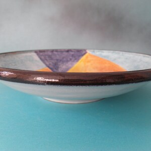 Artistic ceramic bowl shaped on the lathe and decorated by hand. image 4