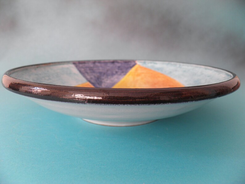 Artistic ceramic bowl shaped on the lathe and decorated by hand. image 4