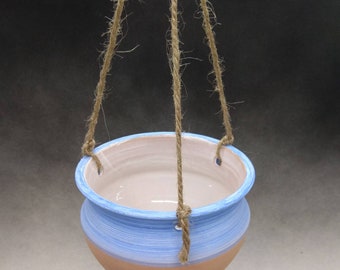 It is a small hanging vase, made on the lathe. High cm. 7.5. Diam. cm. 10. Use as a flower holder or as a bird feeder.