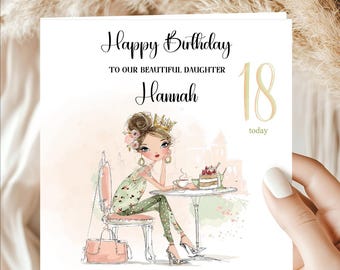 May include: A square birthday greeting card featuring a watercolor illustration of a person sitting at a table with a cake and coffee. The text reads Happy Birthday TO OUR BEAUTIFUL DAUGHTER Hannah 18 today in black and gold lettering.