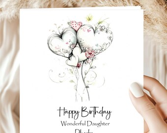 May include: A white greeting card with a watercolor illustration of heart-shaped balloons and floral accents. The card reads "Happy Birthday, Wonderful Daughter, Pheobe" in elegant script, perfect for a birthday celebration.