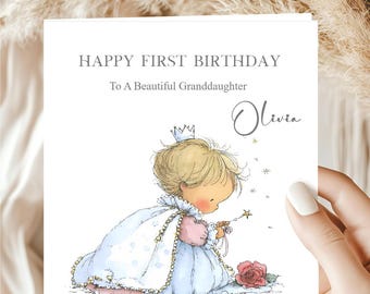 May include: A greeting card with the text "HAPPY FIRST BIRTHDAY To A Beautiful Granddaughter Olivia". The card features an illustration of a child in a princess dress holding a magic wand, with a rose at the bottom.