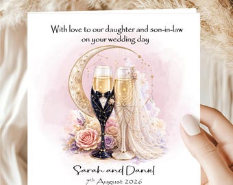 May include: Wedding card with a watercolor illustration of two champagne flutes, one adorned with a tuxedo design and the other with a bridal veil. The card includes the text "With love to our daughter and son-in-law on your wedding day" and the names "Sarah and Daniel" with the date "7th August 2026".