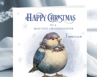May include: A square greeting card with a white background featuring a watercolor illustration of a plump bird with blue and purple feathers wearing a beaded collar. The text reads Happy Christmas to a beautiful granddaughter and Francesca.