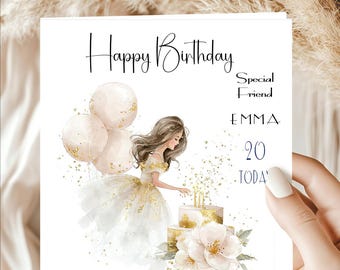 May include: A birthday card with the text "Happy Birthday" in elegant script. The card features an illustration of a woman in a white and gold dress, balloons, a cake, and the name "EMMA" with the number "20".