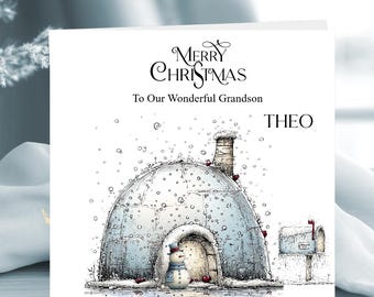 May include: A square Christmas greeting card featuring a hand-drawn illustration of an igloo with a chimney, a small snowman in front, and a mailbox. The text reads Merry Christmas To Our Wonderful Grandson and the name THEO in black ink.