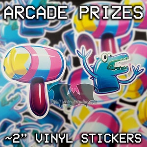 Vinyl stickers, one of a colourful inflatable mallet and one of a finger toy often seen as arcade prizes.