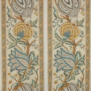 May include: Floral fabric with a repeating pattern of large, stylized flowers in shades of yellow, blue, and brown. The design includes detailed leaves and stems against a cream background, with vertical striped borders.