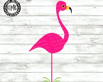 May include: Pink flamingo silhouette with a yellow beak and a green grass base. The image includes the text "SVG DXF PNG".
