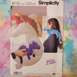 May include: Simplicity sewing pattern number 8715, one size, for making a dragon and unicorn plush toy. The pattern includes instructions for making a red dragon and a purple unicorn. The pattern is designed and printed in the USA.