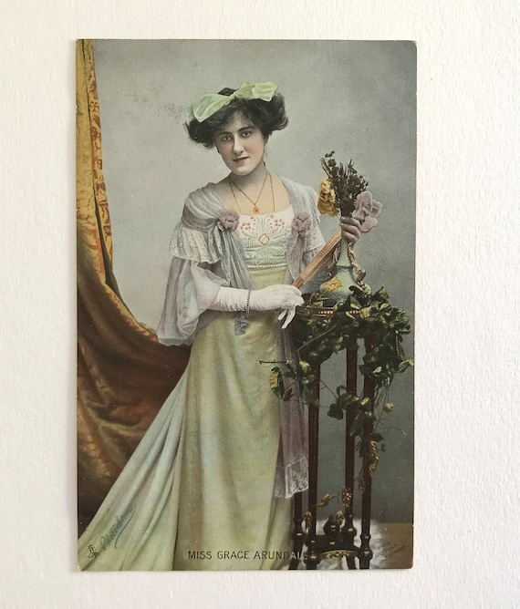 UK c. 1904 Art Nouveau postcard lady holding lit vase, gold highlights UK c. 1904 Art Nouveau postcard lady holding lit vase, gold highlights