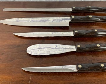 unknown PLAIN CURVED SET OF 4 STAINLESS STEAK KNIVES BY J A