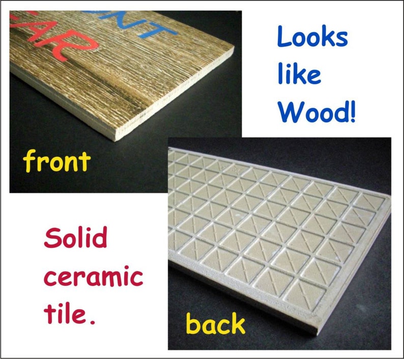 May include: A ceramic tile with a wood-look design on the front and a triangular pattern on the back. The tile is solid and looks like wood.