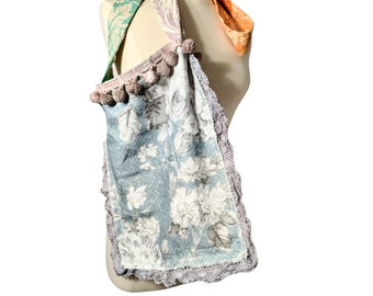 Handmade messenger crossbody bag, long strap. Light pale blue, gray patchwork strap. Reclaimed linen and vintage bobble trim. One of a kind.