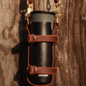 120BOTTLESTRAPLEA Leather bottle holder with straps - Small Leather Goods -  Maje.com