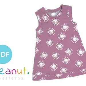 May include: A sleeveless, mauve-colored dress with a white sun print. The dress has a round neckline and a slightly flared skirt.