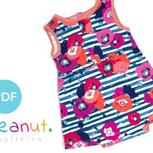 May include: A sleeveless dress with a floral print on a blue and white striped background. The dress has a coral colored neckline and a PDF label.