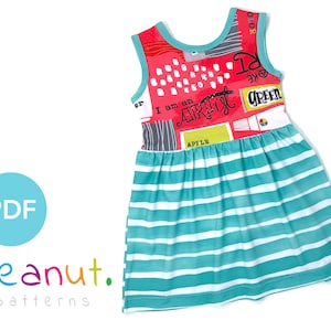 May include: A sleeveless red, white, and gray dress with a colorful print that says "I am an artist" and "Green" on the bodice. The skirt is teal blue with white stripes.