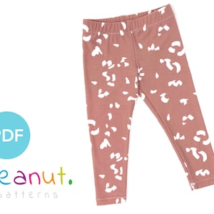 May include: A pair of pink leggings with a white abstract print. The leggings are made of a soft, stretchy fabric and are perfect for everyday wear.