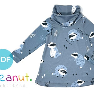 May include: A blue long-sleeved dress with a turtleneck collar and a badger print. The dress has a loose fit and is perfect for a casual look.