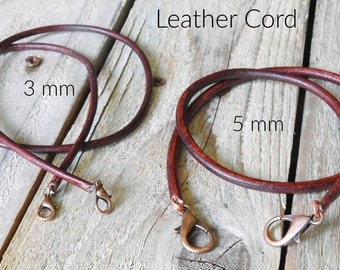 May include: Two dark brown distressed leather cords with copper-toned lobster claw clasps. One cord is labeled 3 mm and the other is labeled 5 mm. The text Distressed Leather Cord is visible at the top of the image.