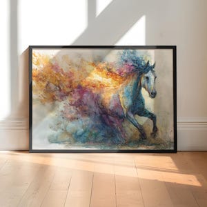 May include: A framed art print showing a watercolour painting of a running horse. The horse is in shades of blue and white, with a flowing mane and tail of vibrant colours. The artwork is set against a neutral background.