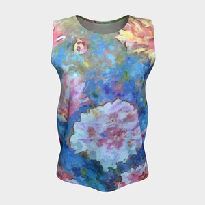May include: A sleeveless tank top with a colorful floral print. The print features pink, blue, and yellow flowers on a light blue background.