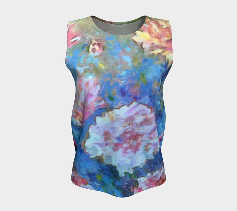May include: A sleeveless tank top with a colorful floral print. The print features pink, blue, and yellow flowers on a light blue background.