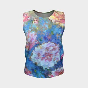 May include: A sleeveless tank top with a colorful floral print. The print features pink, blue, and white flowers on a blue background.