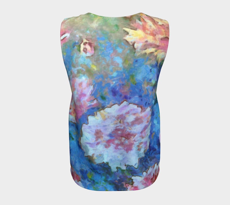 May include: A sleeveless shirt with a colorful abstract floral print. The print features shades of blue, pink, yellow, and green.