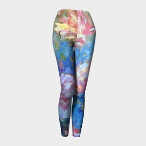 May include: Colorful leggings with a watercolor-style floral pattern in shades of pink, blue, and yellow.