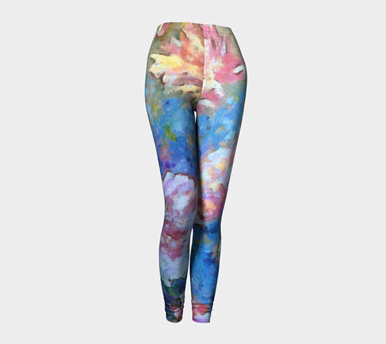 May include: Colorful leggings with a watercolor-style floral pattern in shades of pink, blue, and yellow.