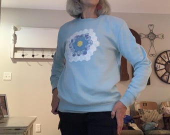 Upcycled baby blue crewneck sweatshirt with a vintage handmade quilt block on the front. SIZE MEDIUM