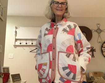 Fan pattern quilted jacket is an upcycled, wearable art piece crafted from a vintage patchwork quilt