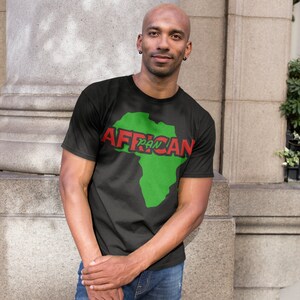 May include: A black t-shirt with a green outline of the continent of Africa and the text "Pan African" in red.