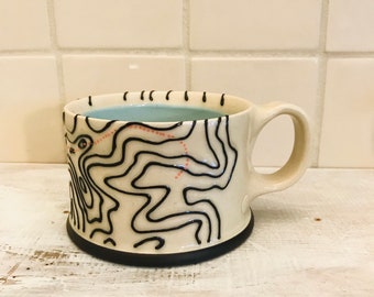 Giant Ledge and Panther - Cappuccino Mug (Sky Blue Interior)
