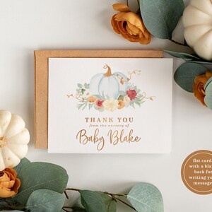 May include: A white card with a watercolor illustration of two blue pumpkins with fall foliage and the text "THANK YOU from the nursery of Baby Blake".