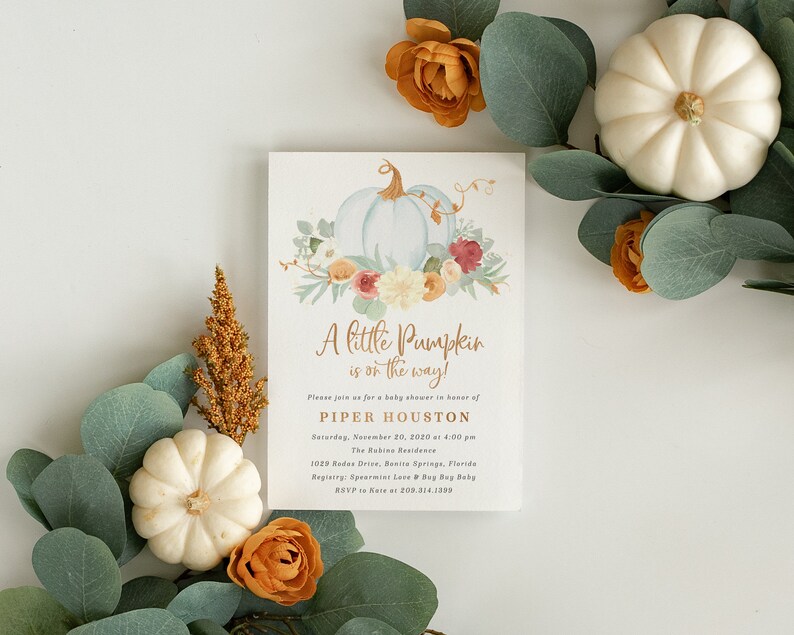May include: A baby shower invitation with a watercolor illustration of a white pumpkin with fall leaves and flowers. The text reads "A little Pumpkin is on the way!" and includes the name Piper Houston, date, time, and location of the event.