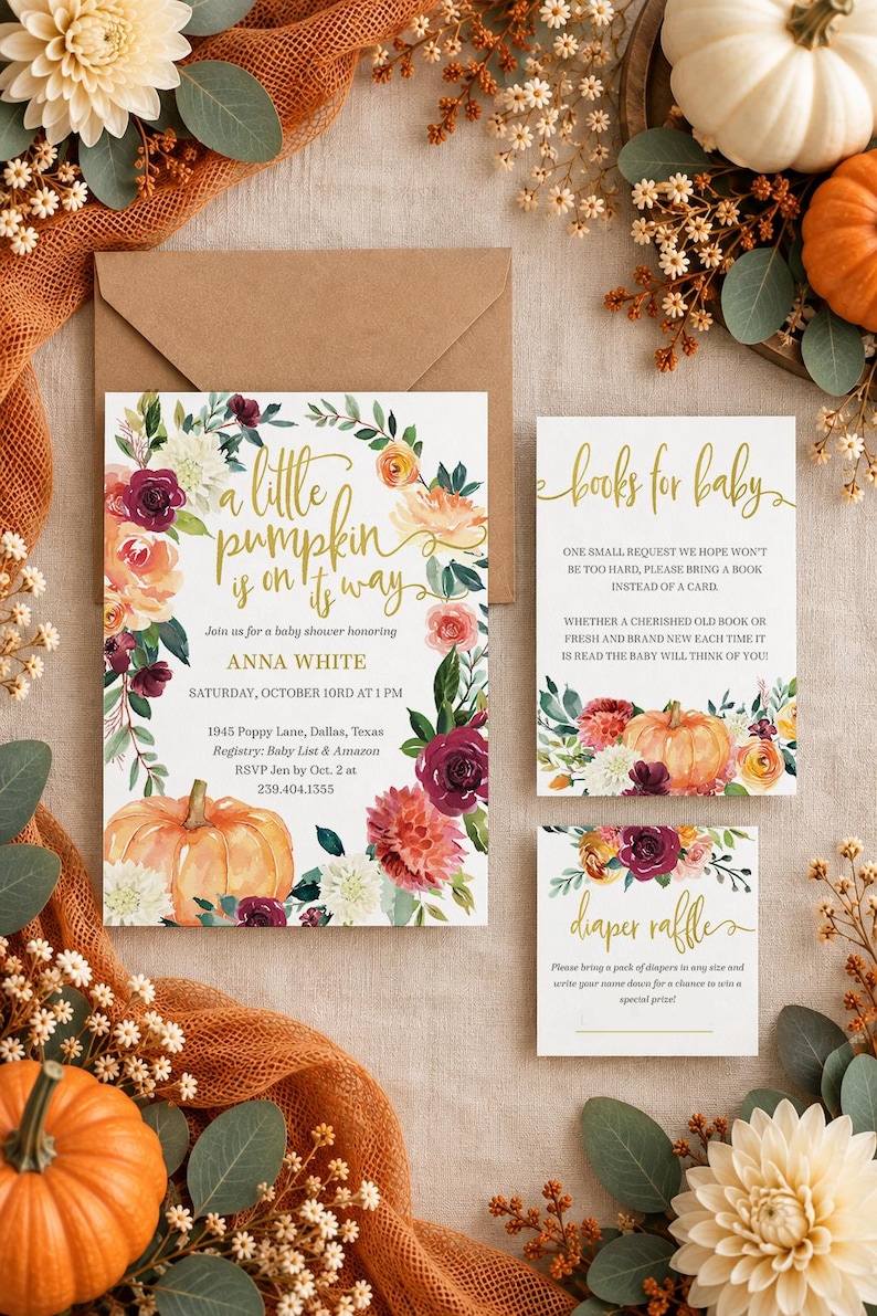 May include: A baby shower invitation set featuring a large card, a books for baby card, and a diaper raffle card. The cards have white backgrounds with gold cursive text and watercolor floral wreaths in orange, burgundy, and cream with pumpkins.