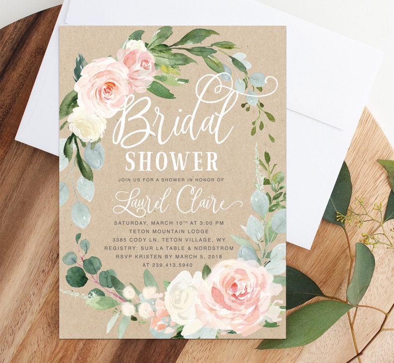 May include: A rustic brown invitation with a floral wreath border in shades of pink, white, and green. The text reads "Bridal Shower" and "Join us for a shower in honor of Laurel Claire". The invitation details the date, time, location, registry, and RSVP information.