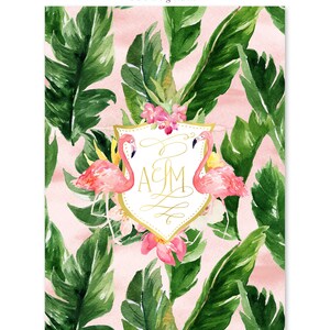 May include: A pink and green tropical wedding invitation with a gold monogram of the letters A & M inside a shield shape. Two pink flamingos flank the shield. The background is a pink watercolor wash with green tropical leaves.